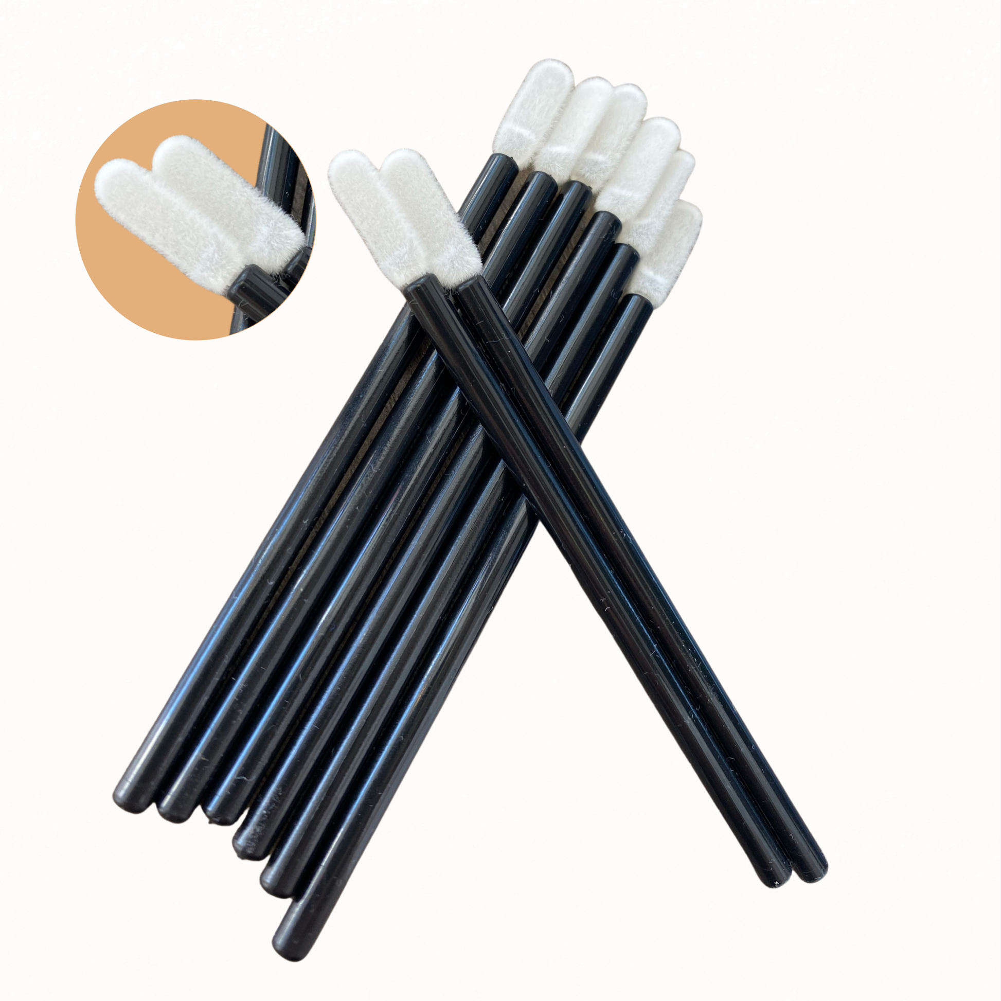 Image of the Flex Tip Applicators which feature a black plastic hand and white lint-free tip. Includes close-up image of lint-free tips.